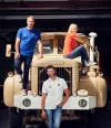 3 people presenting merchandising on a Berliet truck